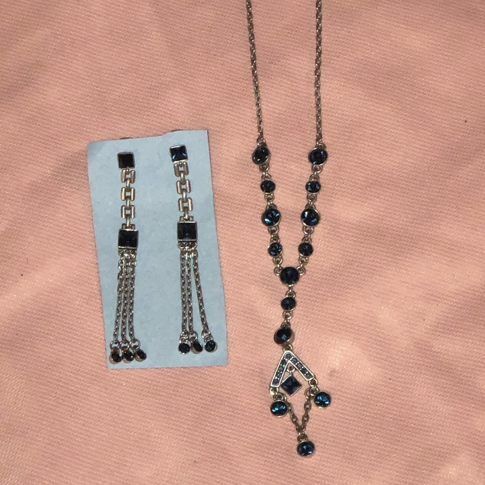 Silver costume jewelry with blue gems.